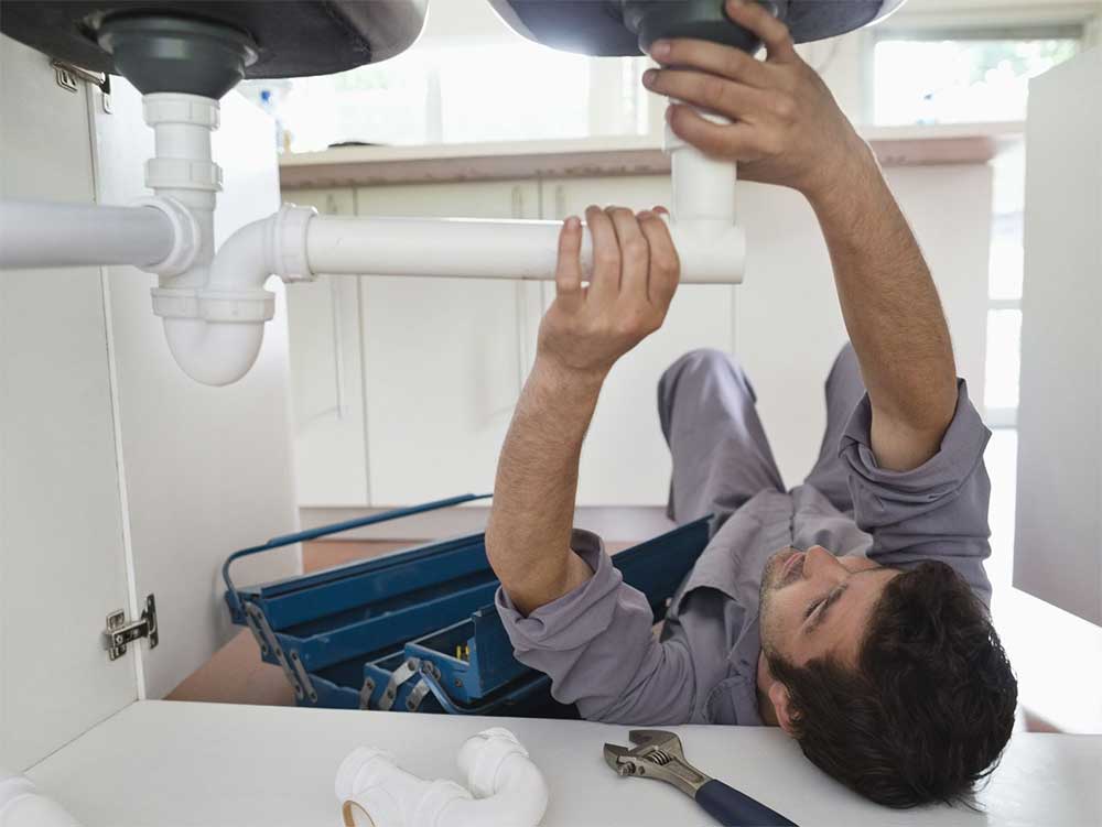 clogged-kitchen-sink drain clogged with hair